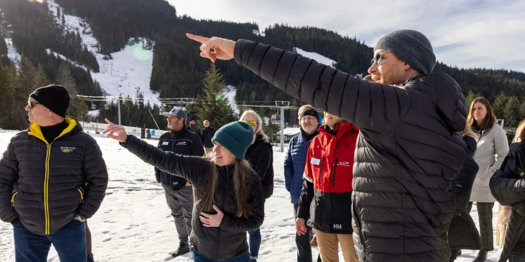 people in the snow watching winter games